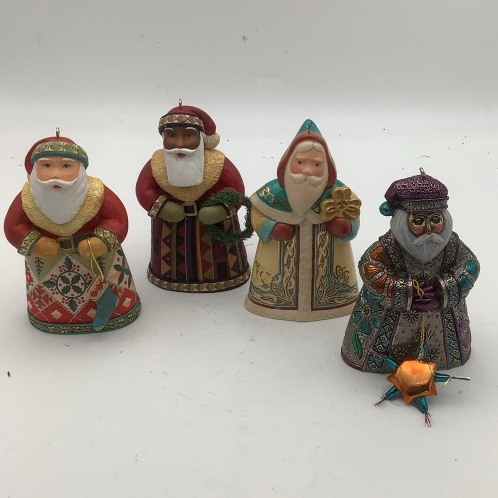 Four vintage Hallmark Santas Around the Word Ornaments